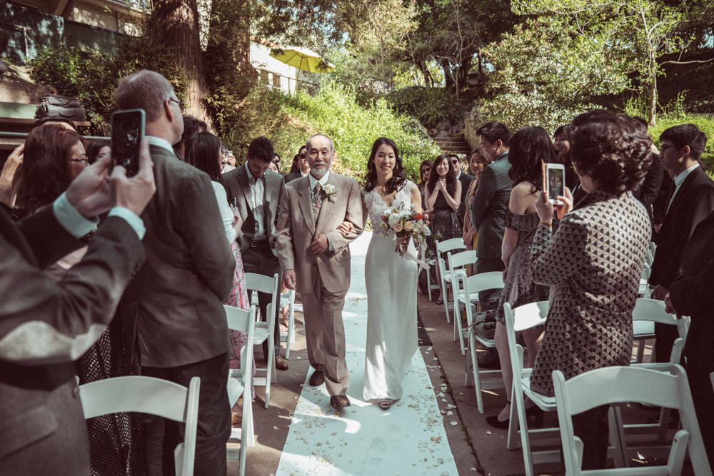 Bride walking down aisle at Piedmont Community Hall wedding