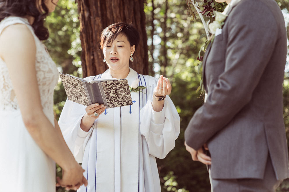 Officiant holding rings at Piedmont Community Hall wedding