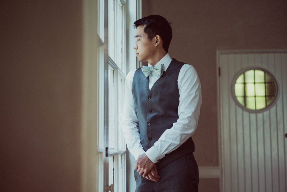 Groom waiting for first look at Piedmont Community Hall wedding