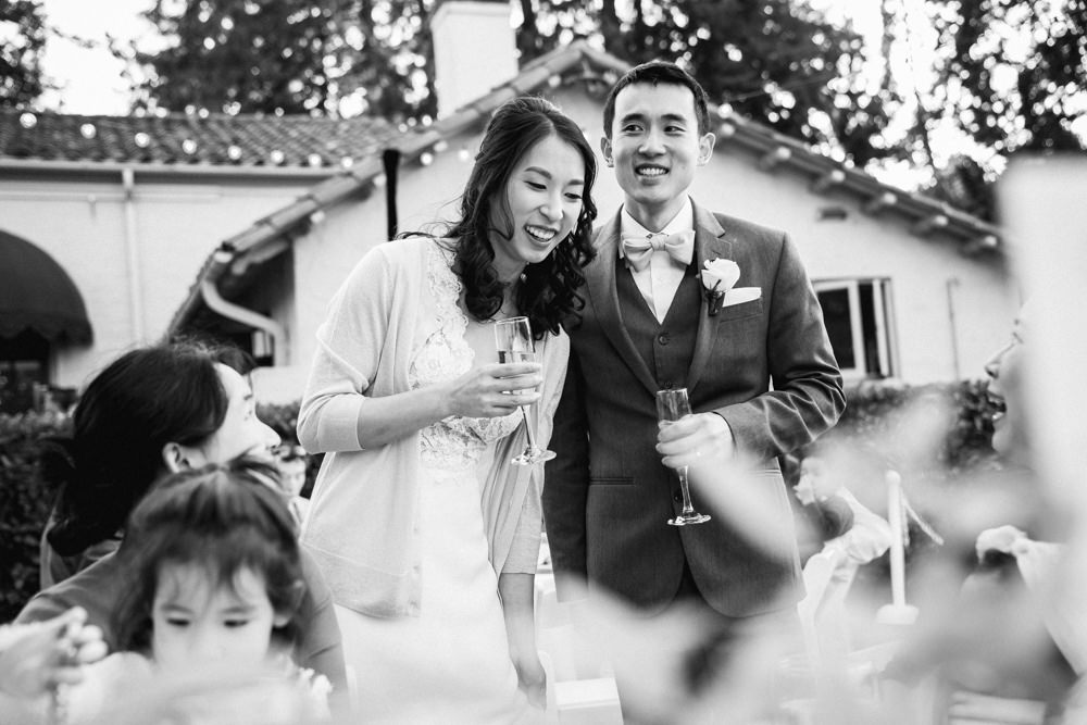 Black and white table visits at Piedmont Community Hall wedding