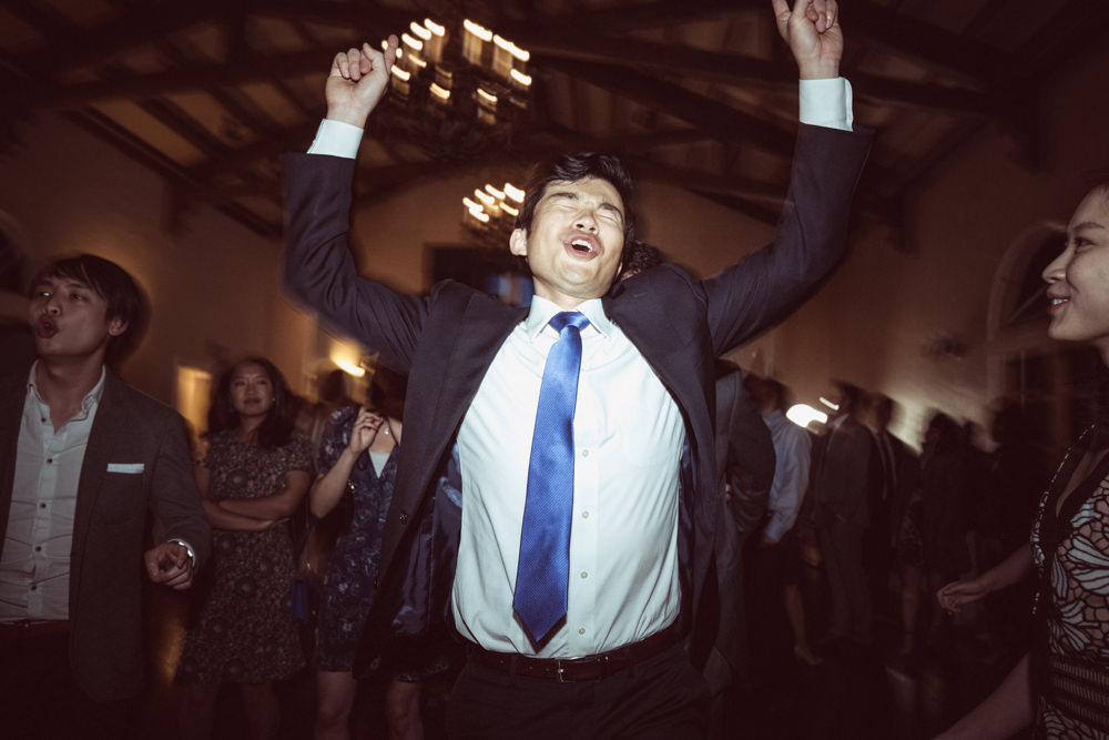 Guest going crazy on dance floor at Piedmont Community Hall wedding