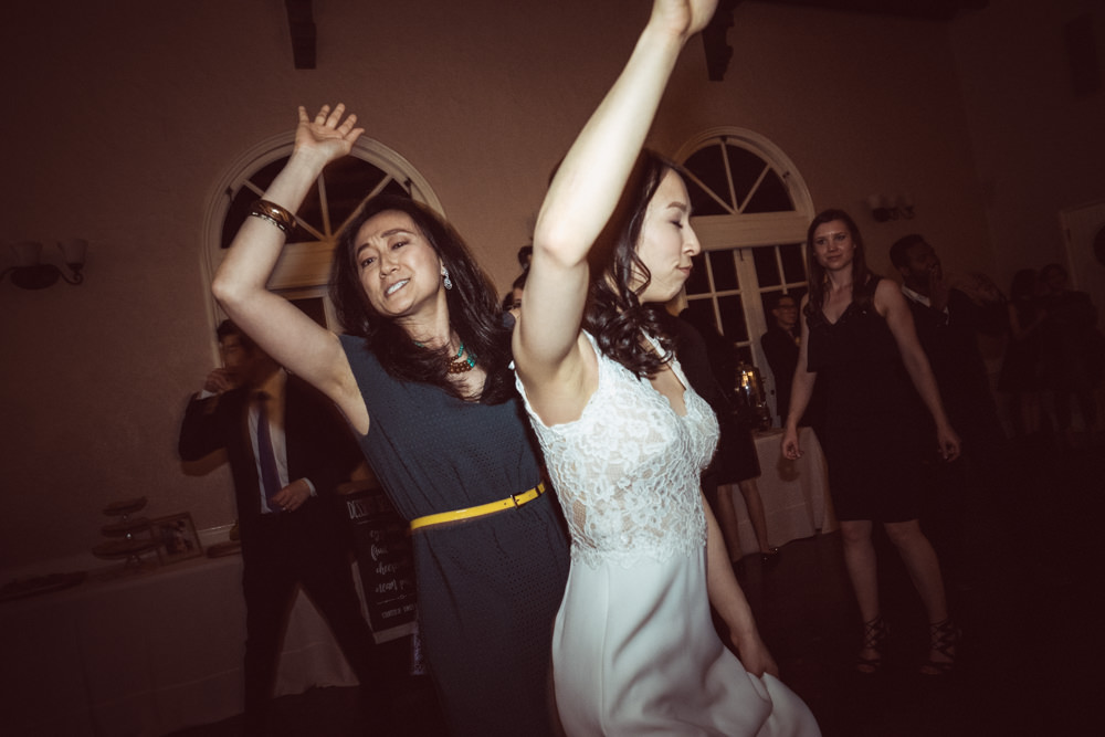 Bride going crazy on dance floor at Piedmont Community Hall wedding