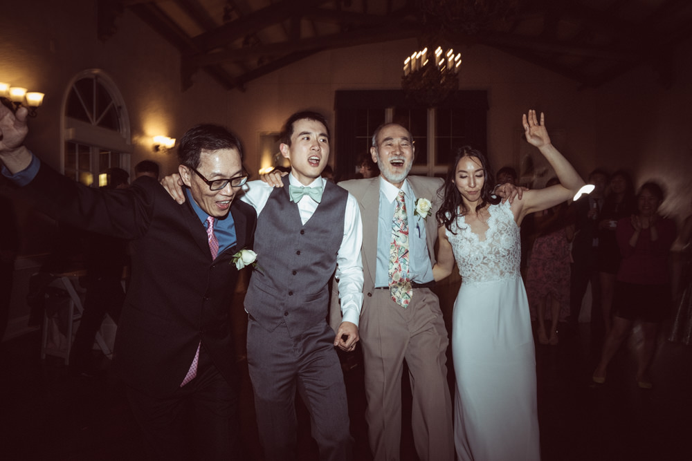 Bride and groom dancing with dads during Piedmont Community Hall wedding