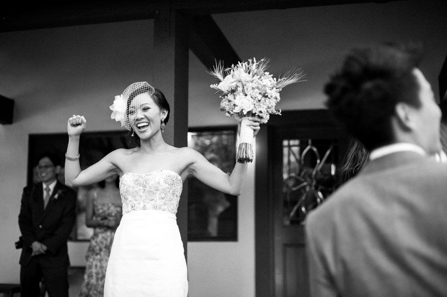 Black and white candid portrait of bride excited during wedding at Saddlerock Ranch