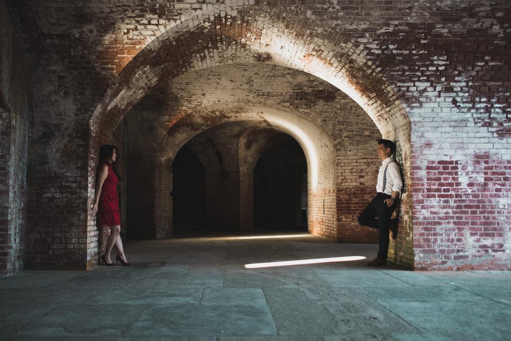 couple standing in tunnel at fort point