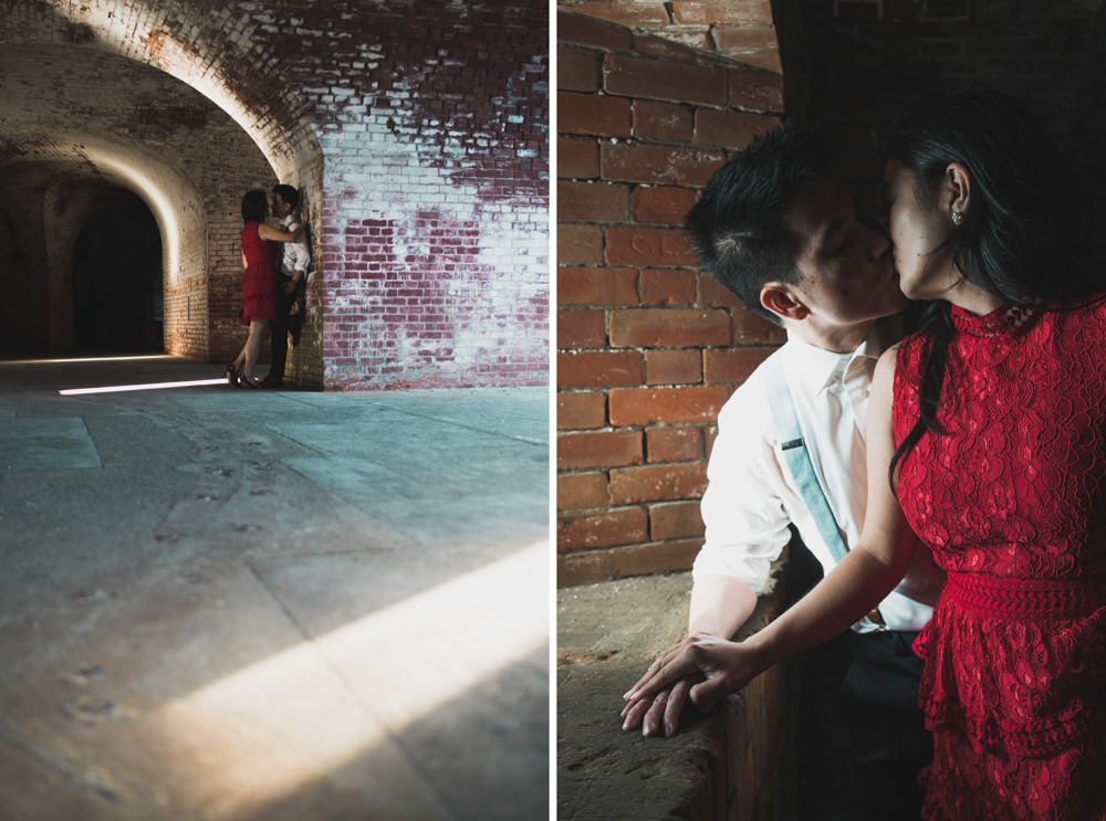 Couple kissing in tunnels at fort point in san francisco