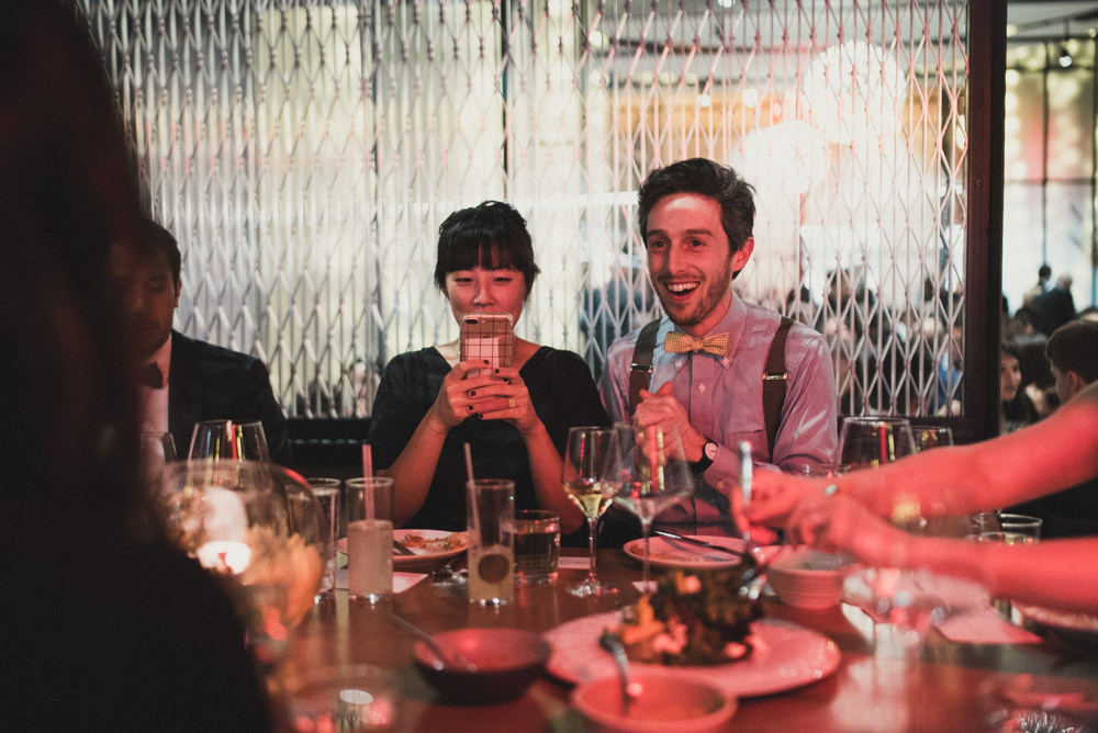 Candid photo of couple laughing during wedding at Mourad's in SF