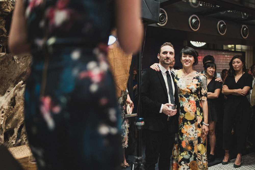 Bride and groom candid shot during wedding toast at Mourad's SF