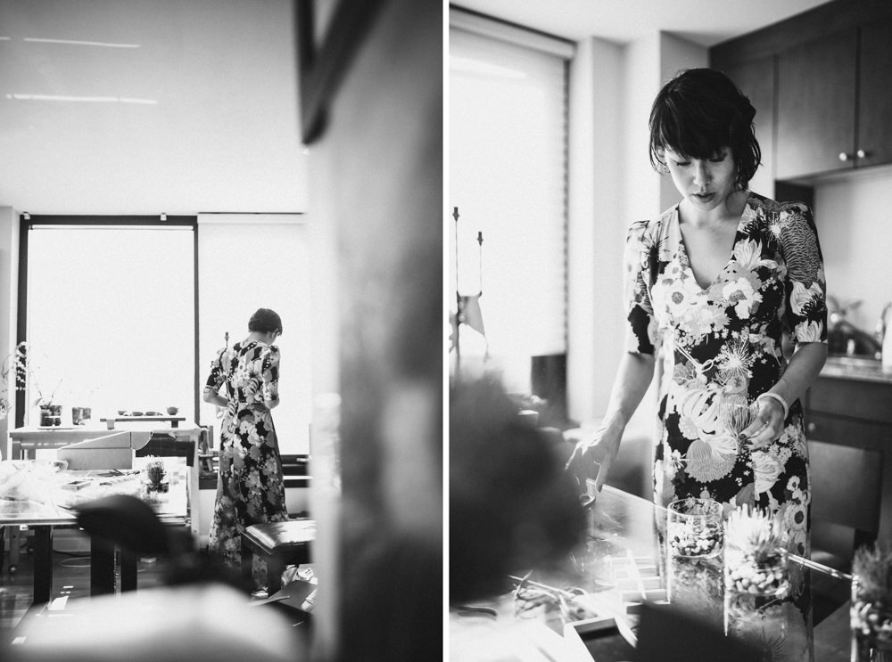 Black and white candid shot of bride in alternative floral wedding dress