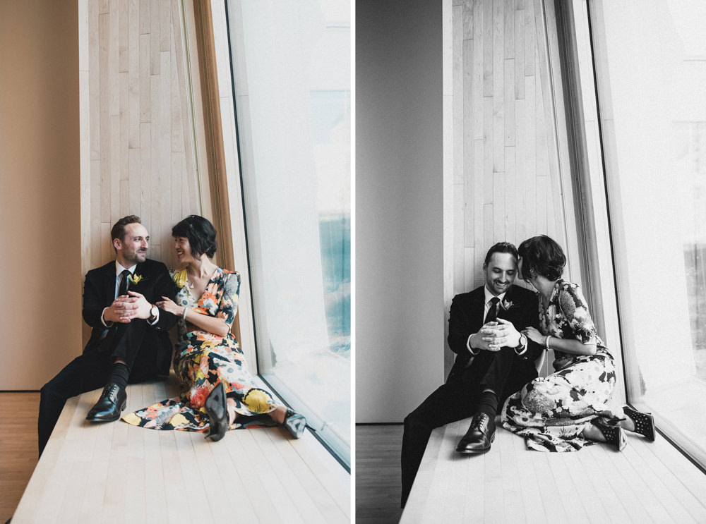 Couple sitting by window during wedding photography in SF MOMA museu