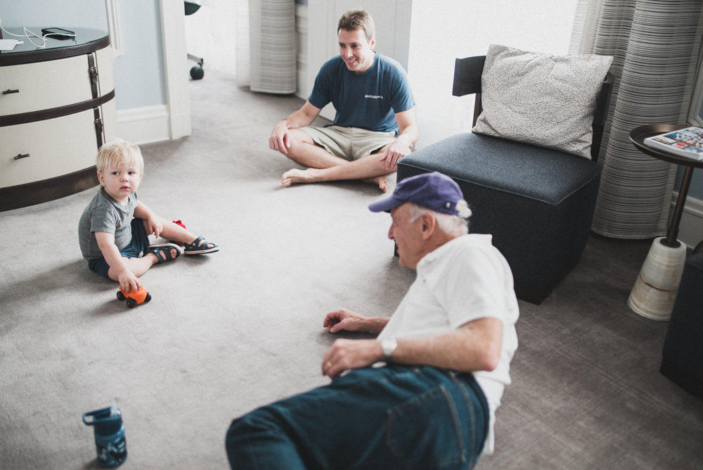 Candid shot of grandfather playing with grandson in the Palace Hotel