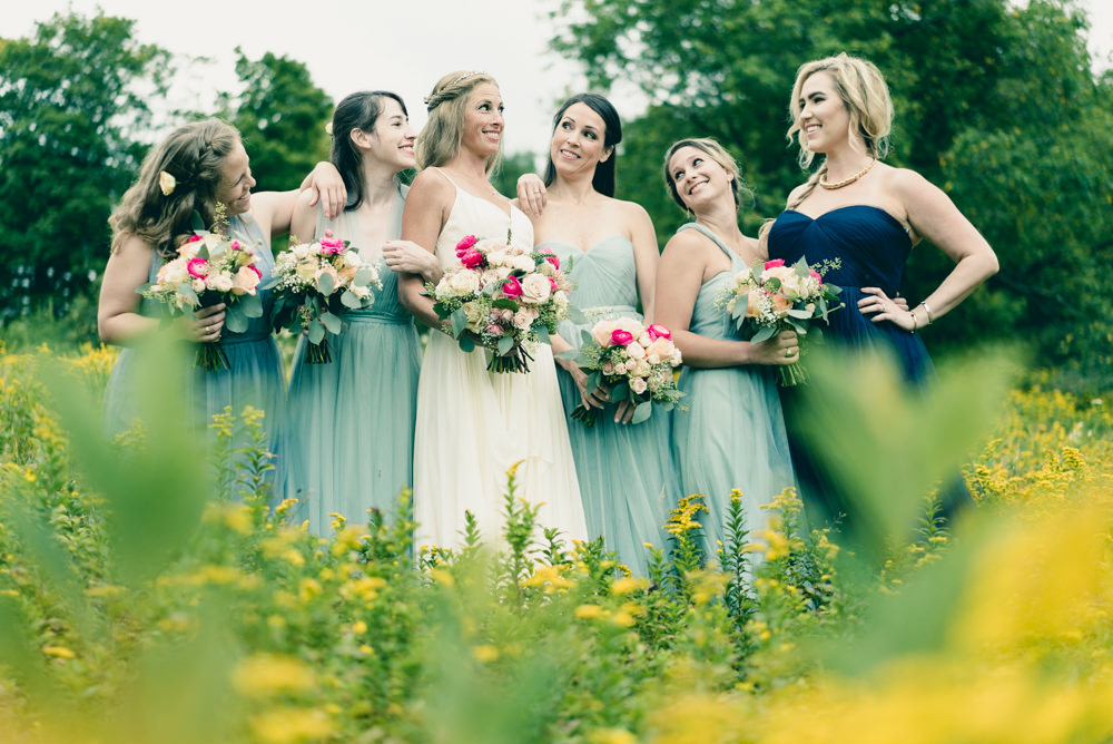 Bridal party shoot in field of wildflowers idea