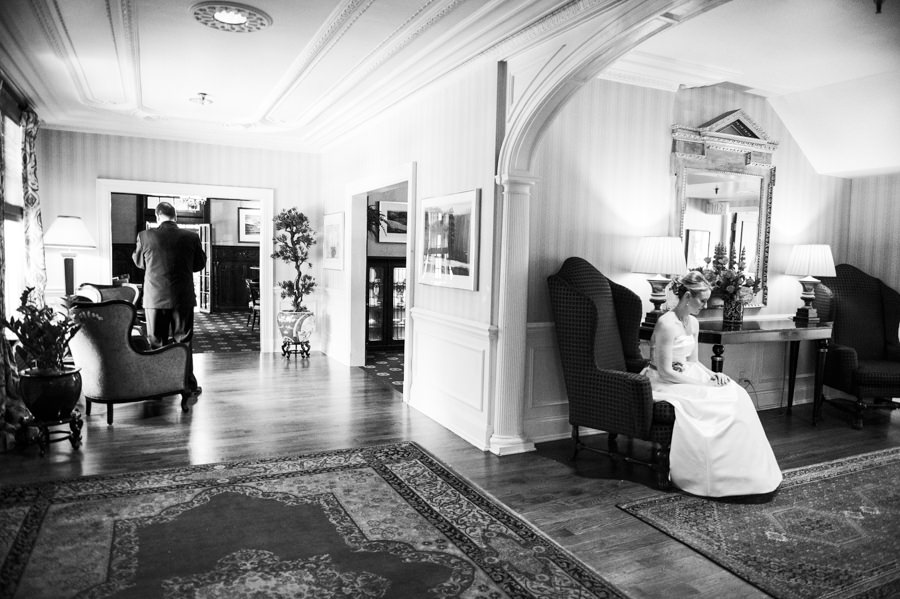 black and white candid shot of bride and groom first look