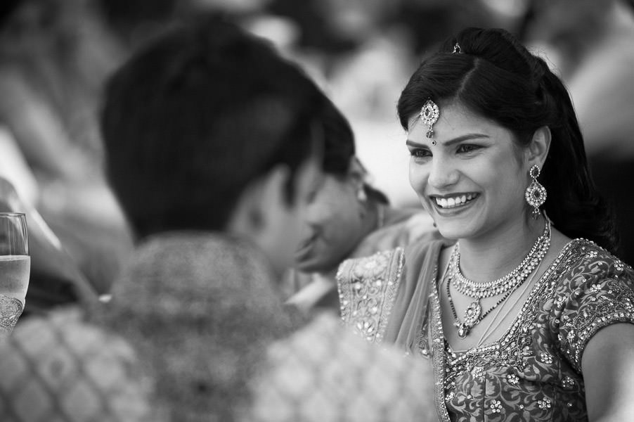 Black and white candid portrait of Indian bride crying during wedding toast at Palmdale Estates